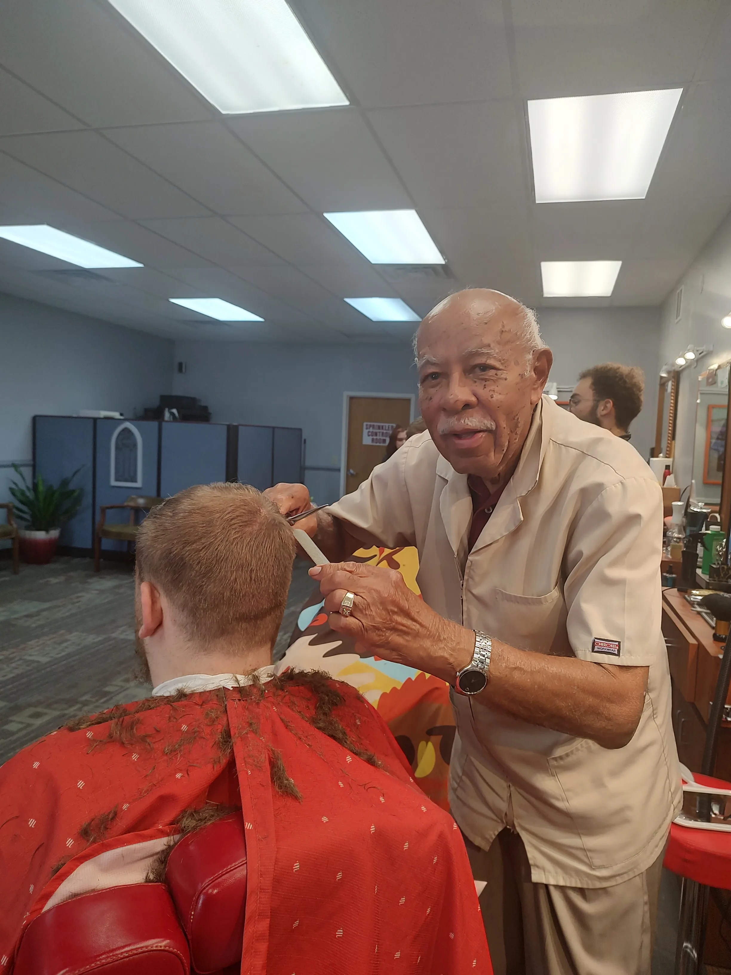 Mr. Johnson cutting hair